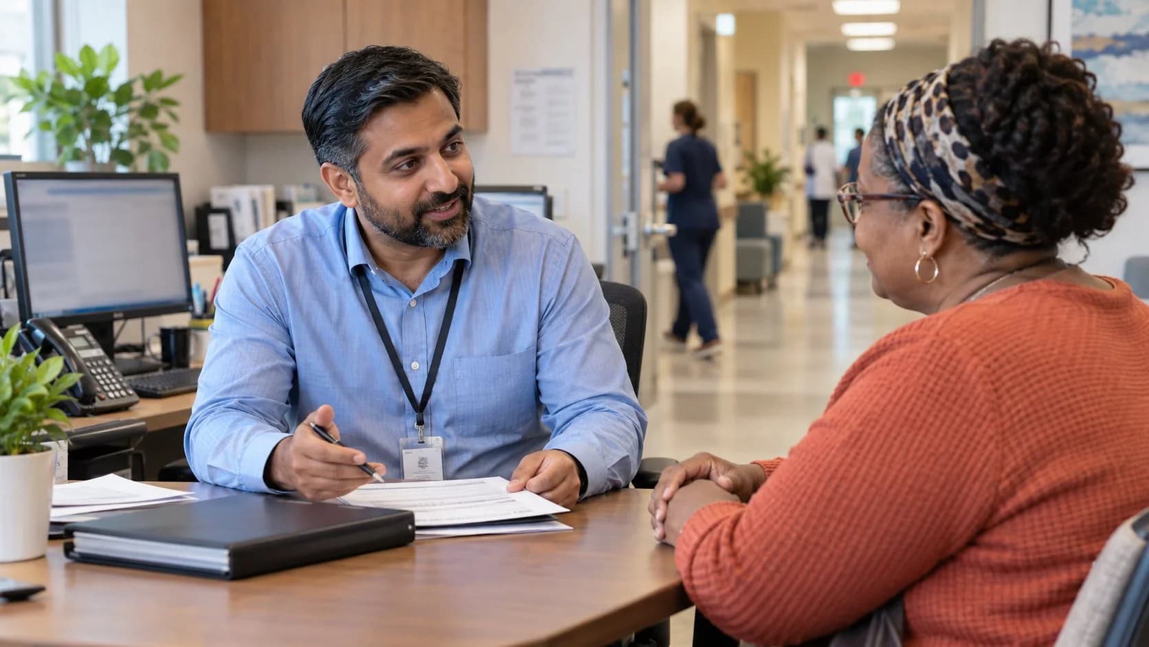 Patient financial counselor explaining a billing responsibility to a patient