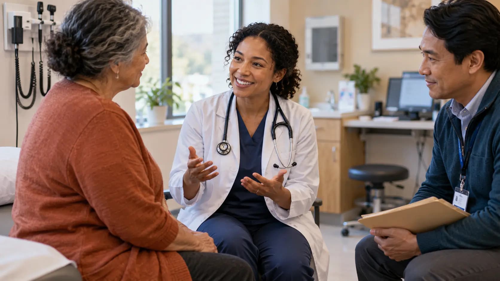 Clinician, patient, and healthcare colleague sharing a warm clinic interaction