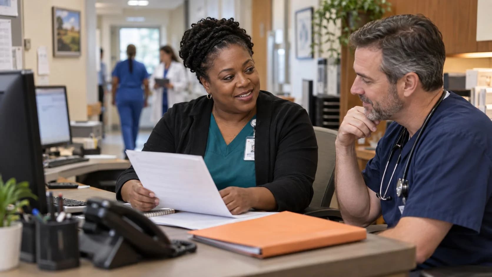 Medical coder and clinician resolving a claim detail together
