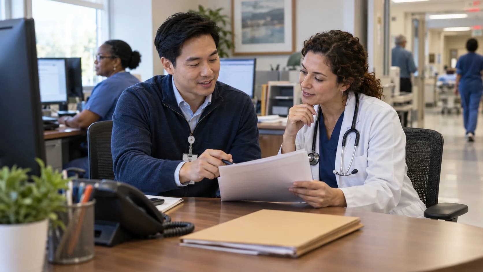 Medical coder and clinician resolving a claim detail together