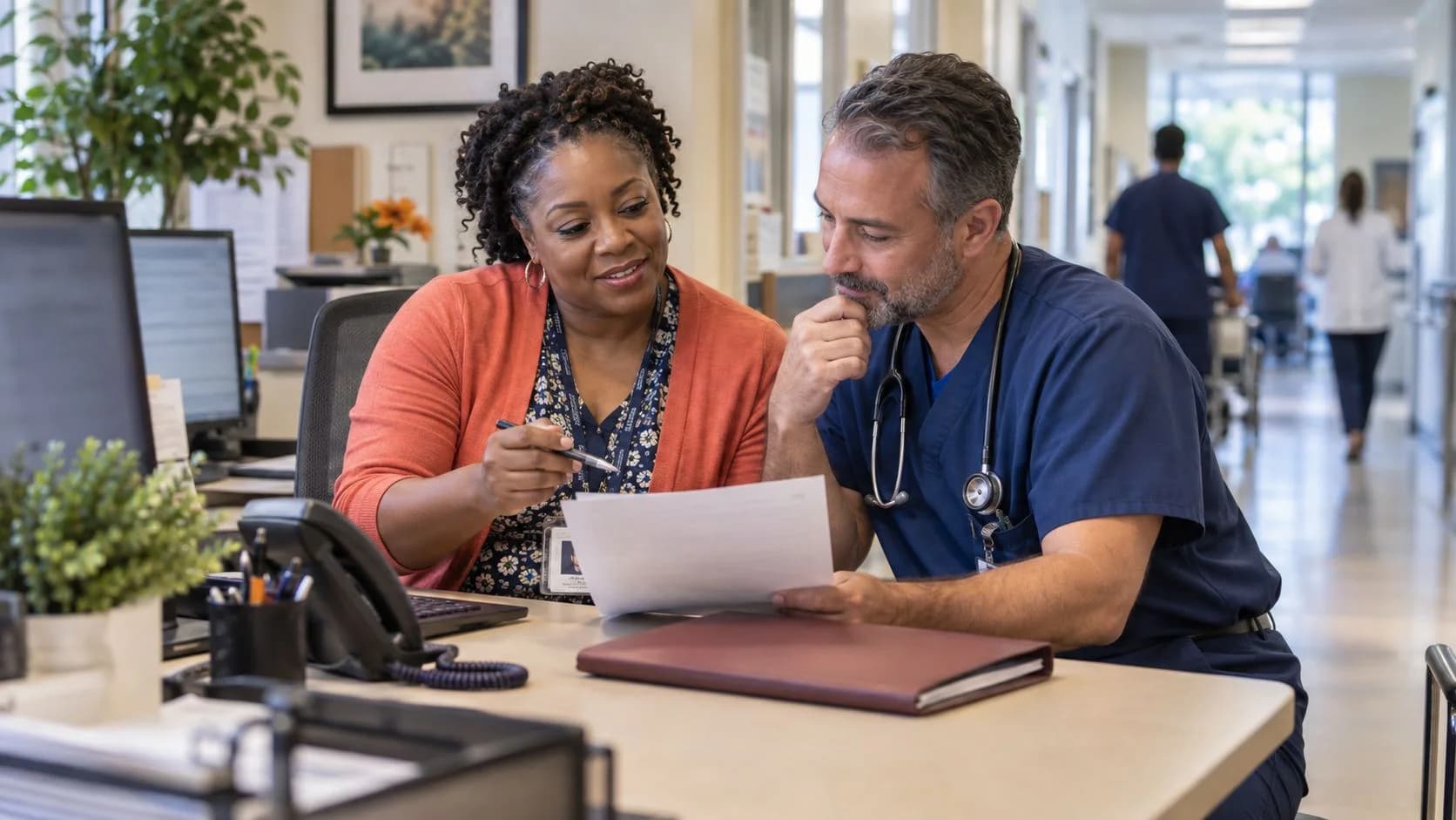 Medical coder and clinician resolving a claim detail together