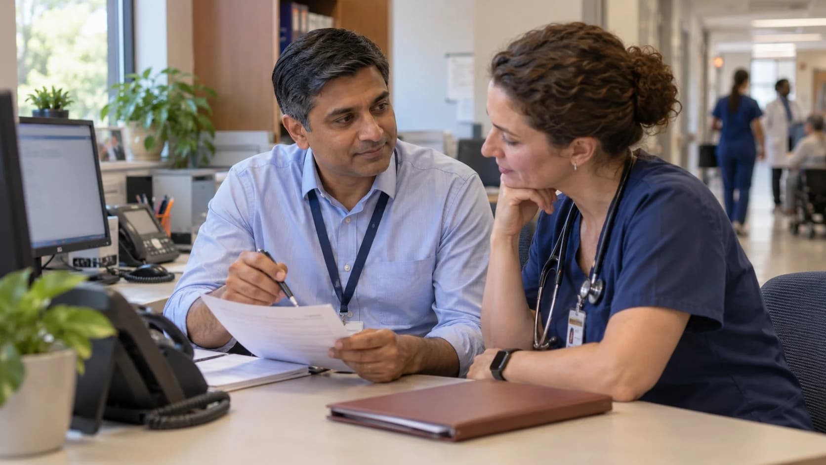Medical coder and clinician resolving a claim detail together
