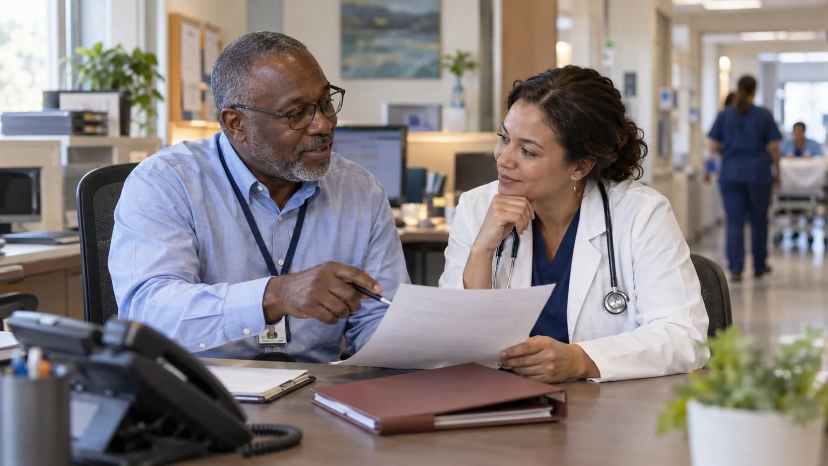 Medical coder and clinician resolving a claim detail together