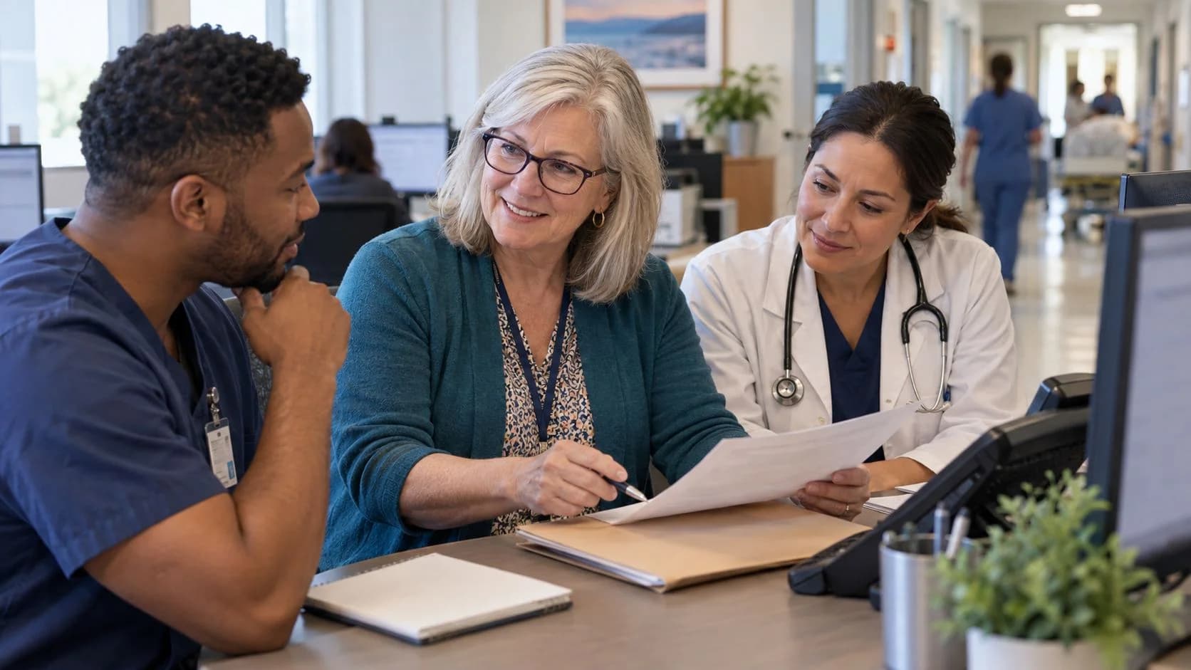 Denial-resolution specialist and clinician reviewing a claim together