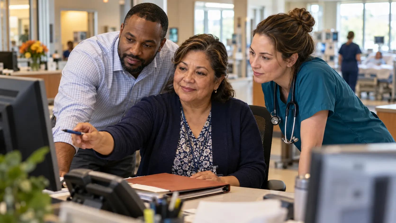 Revenue-cycle specialist and clinician resolving a billing workflow together Revenue-cycle specialist and clinician resolving a billing workflow together