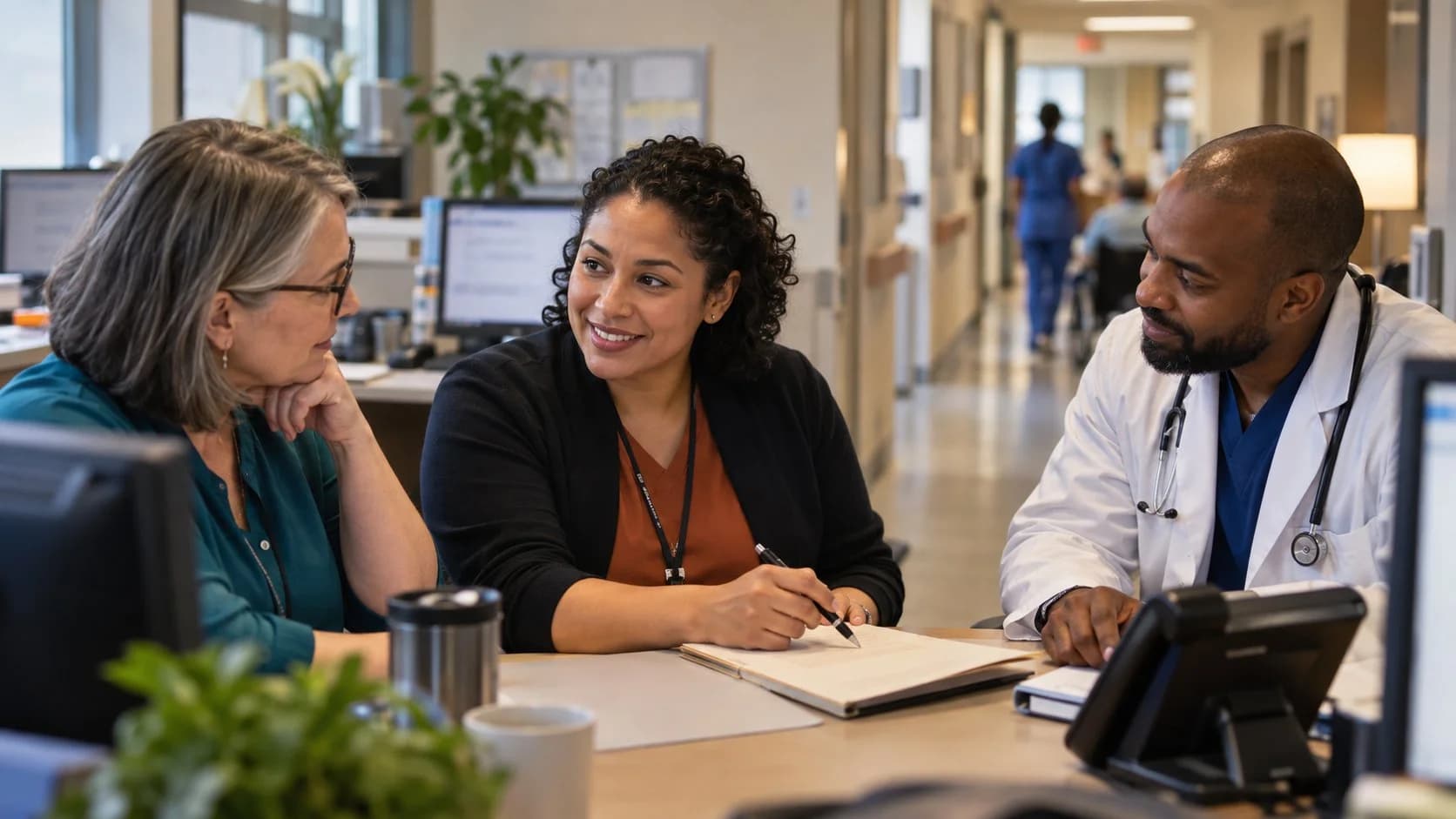 Denial-resolution specialist and clinician reviewing a claim together