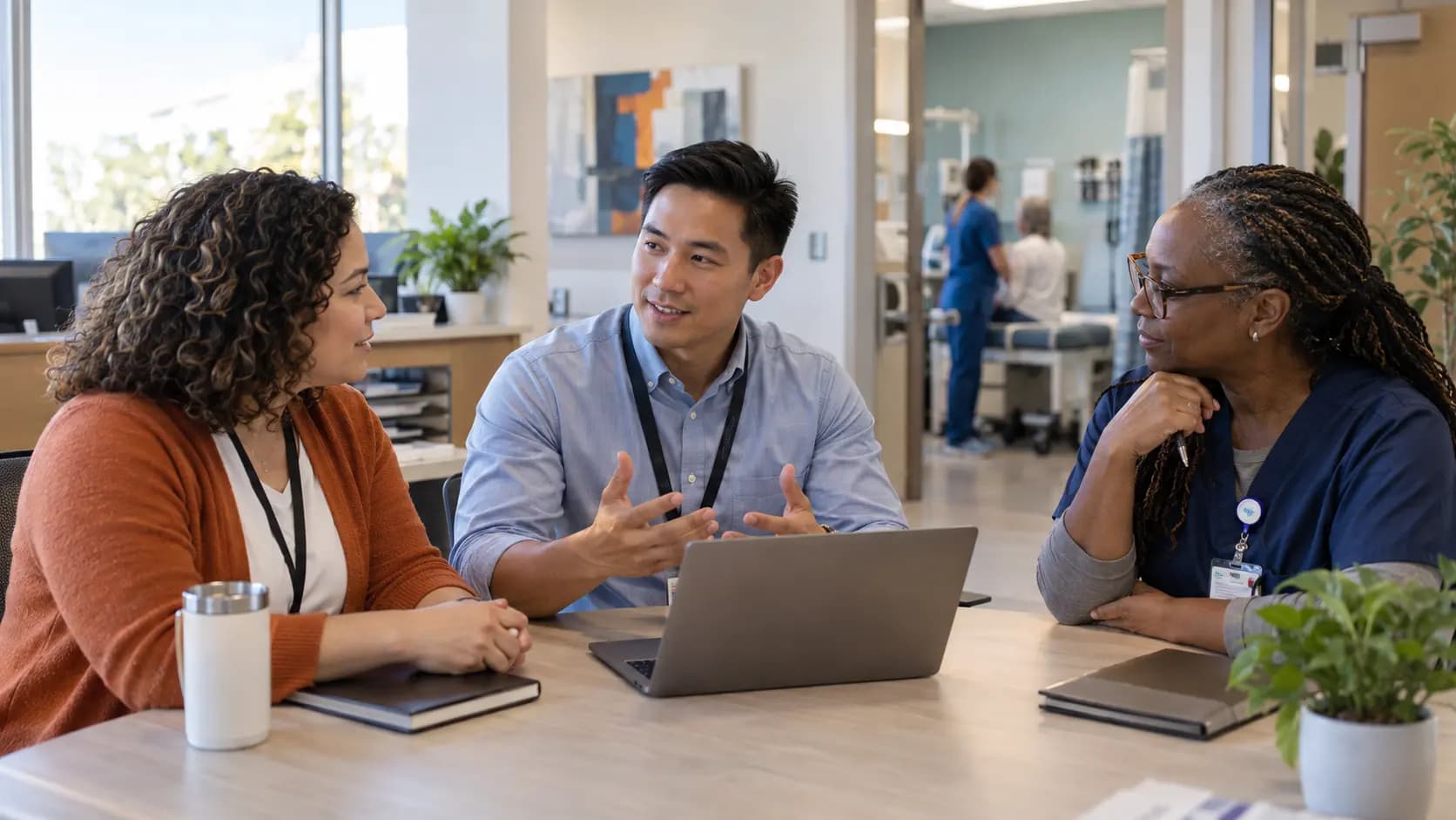 Healthcare operations and compliance colleagues collaborating in an office