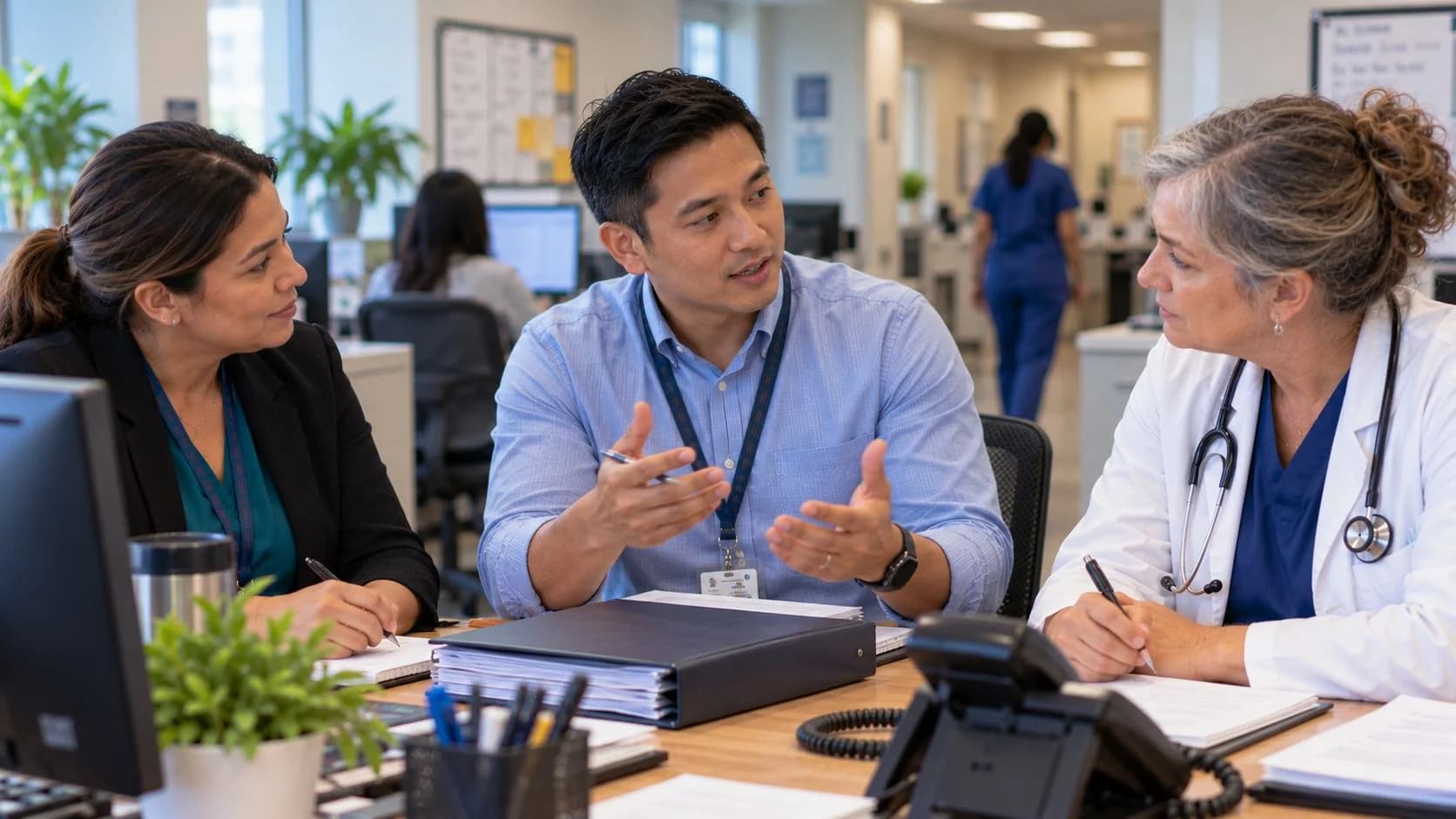 Denial-resolution specialist and clinician reviewing a claim together