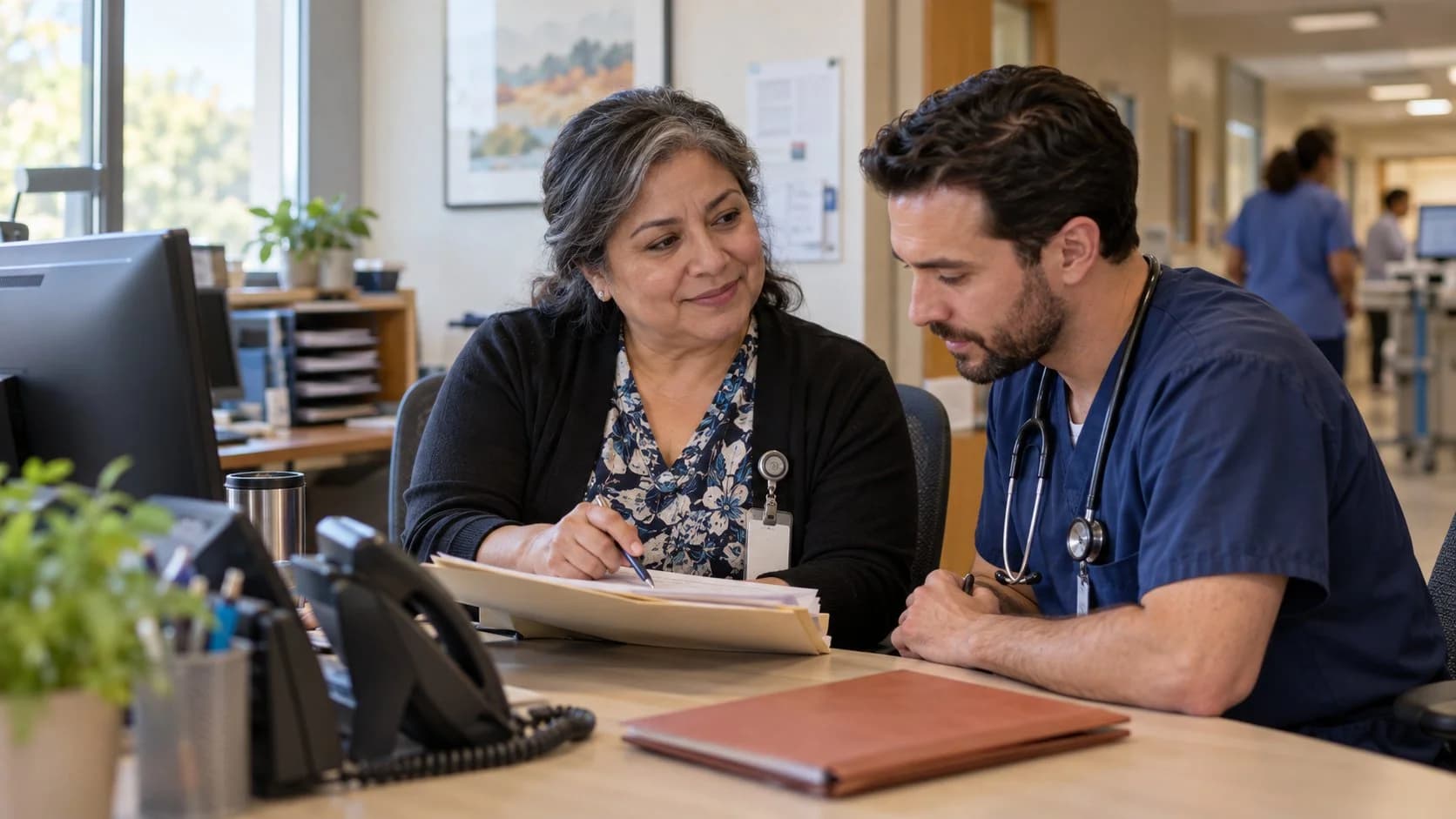 Medical coder and clinician resolving a claim detail together
