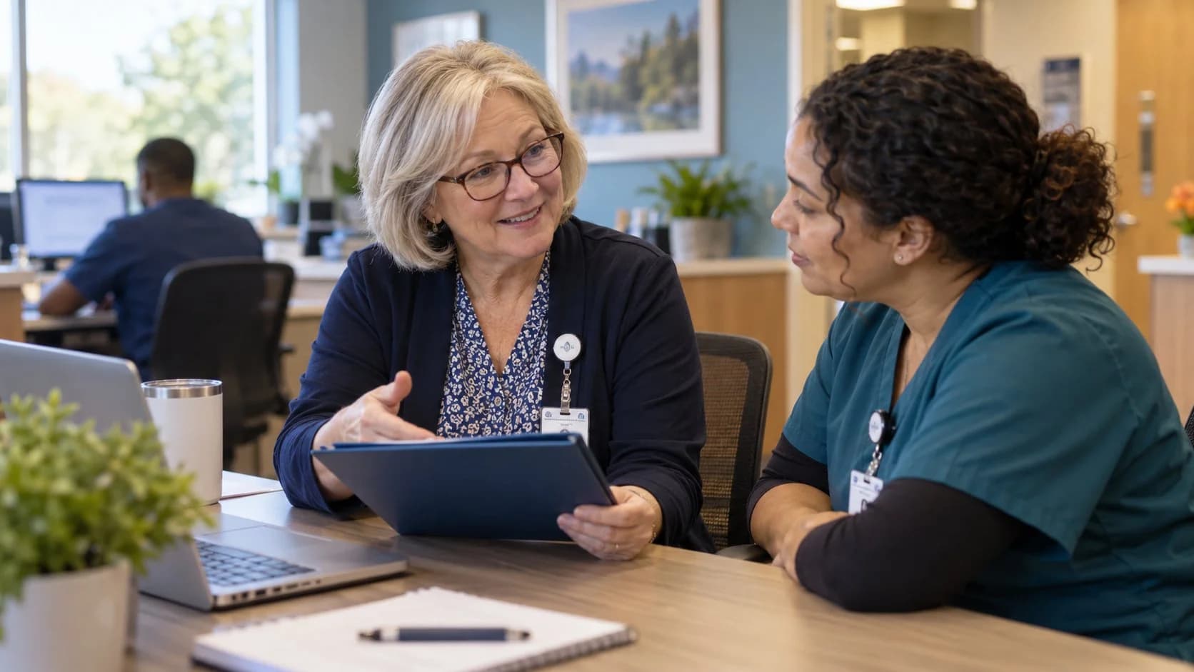 Healthcare compliance officer reviewing a safe workflow with clinic staff