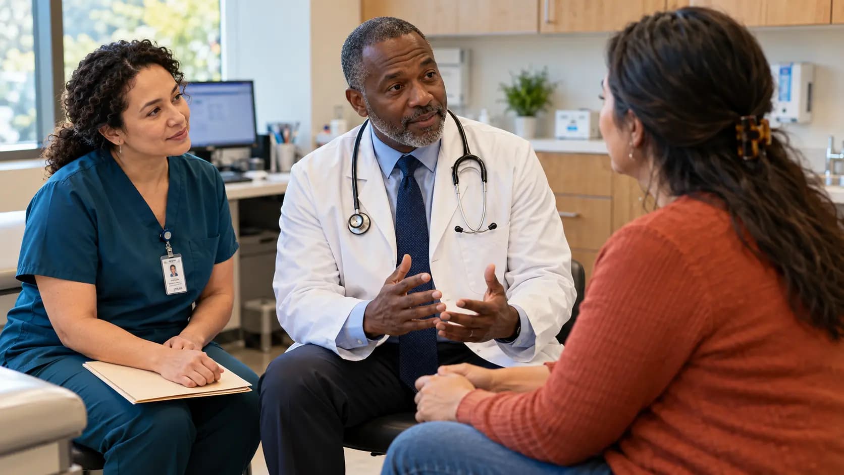 Clinician, patient, and healthcare colleague sharing a warm clinic interaction Clinician, patient, and healthcare colleague sharing a warm clinic interaction