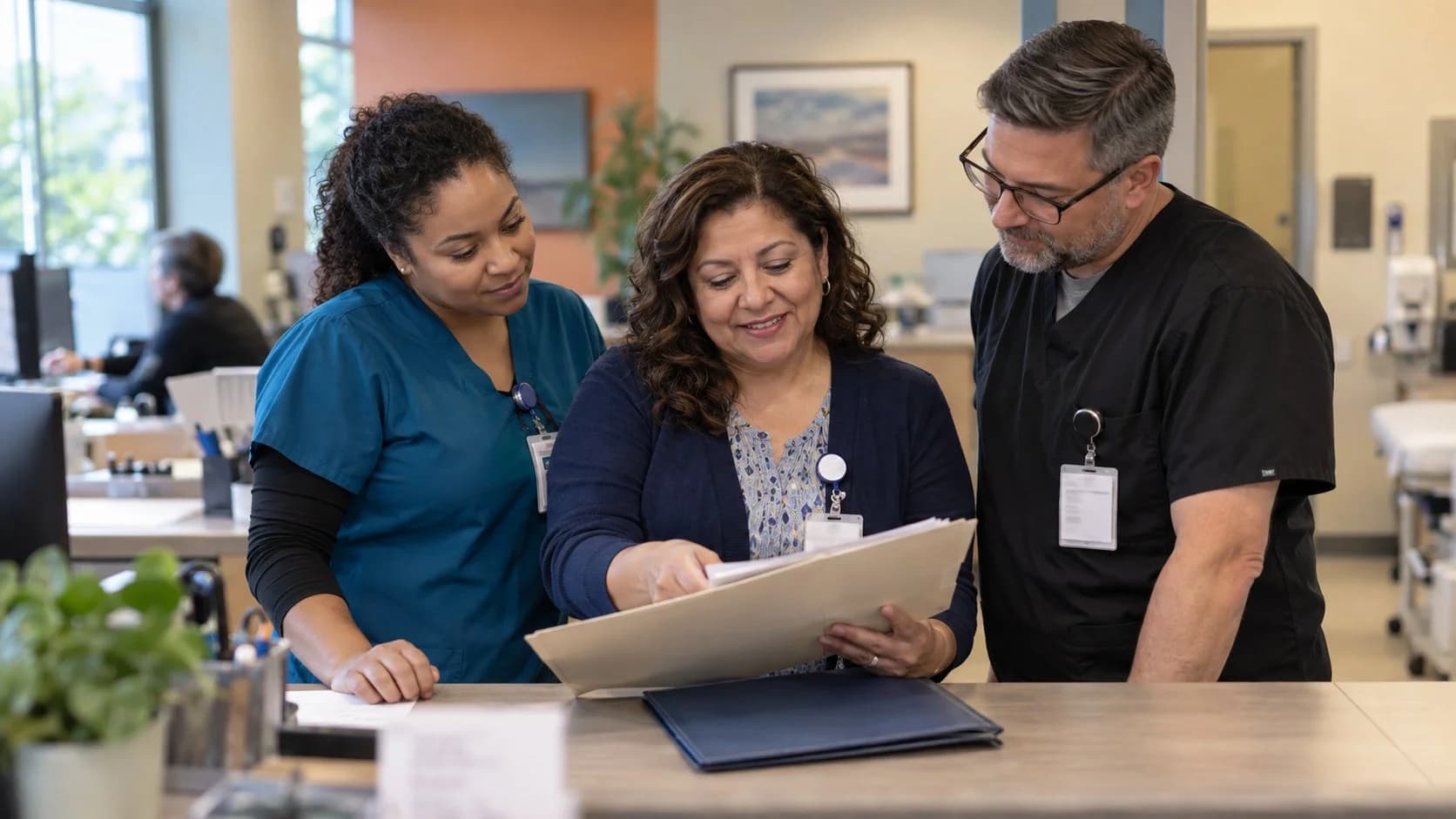 Revenue-cycle educator discussing a workflow with medical-office colleagues
