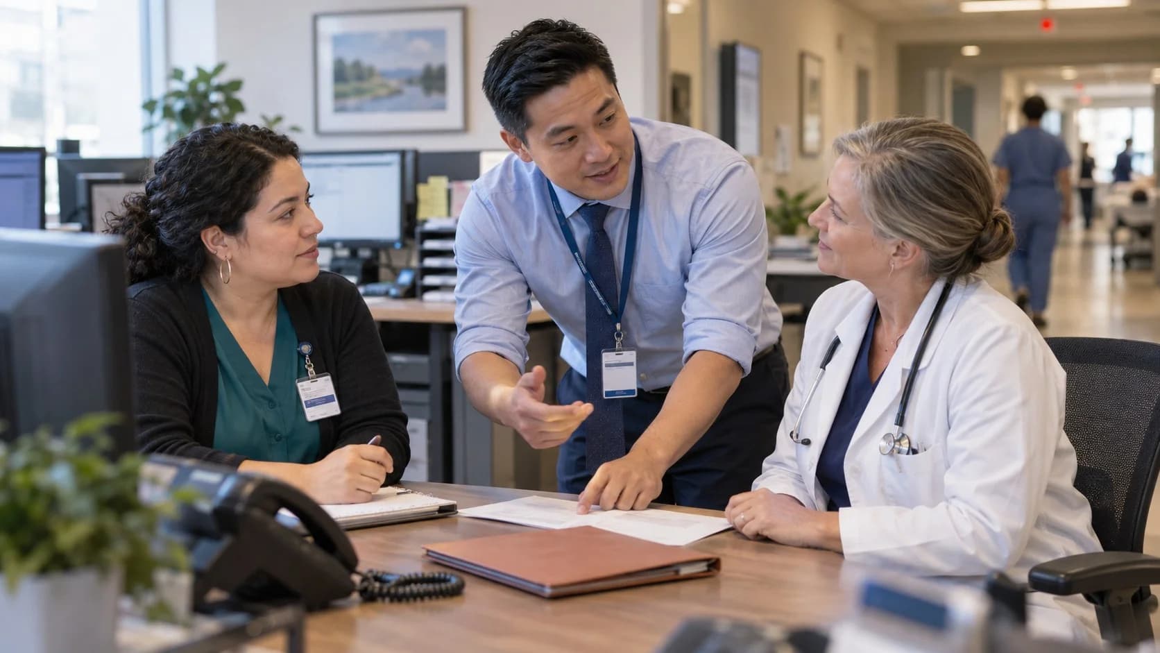 Denial-resolution specialist and clinician reviewing a claim together