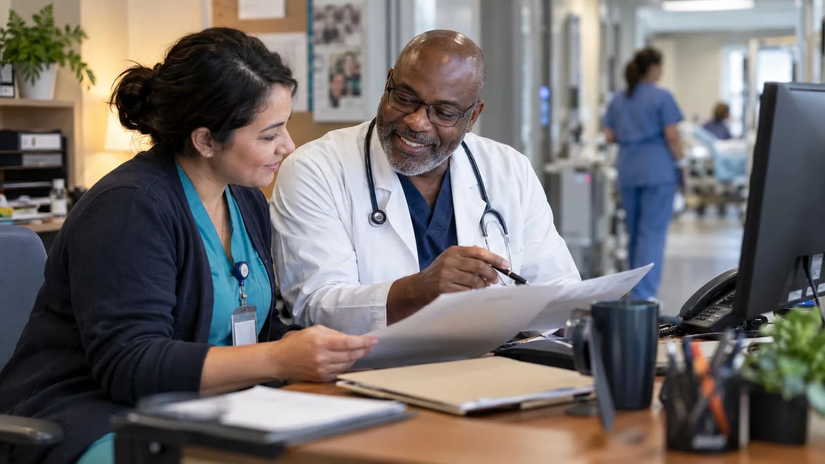 Medical coder and clinician resolving a claim detail together