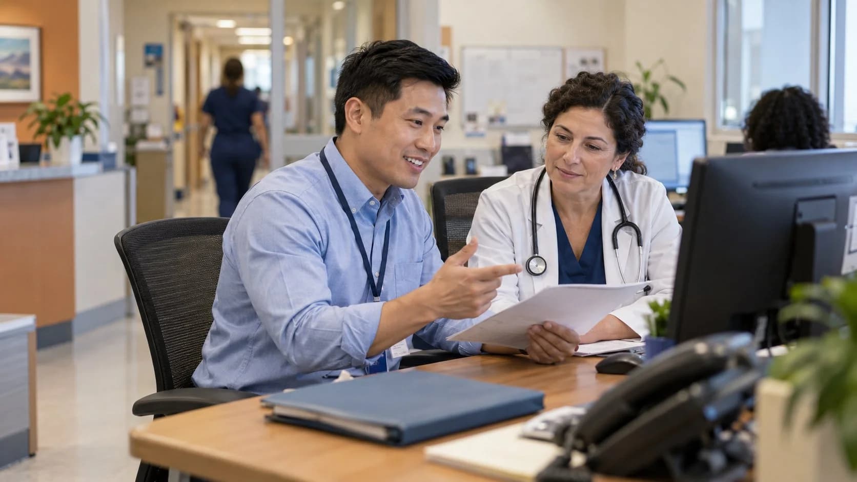 Medical coder and clinician resolving a claim detail together