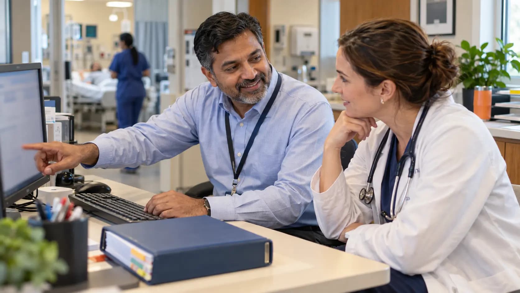 Medical coder and clinician resolving documentation together Medical coder and clinician resolving documentation together