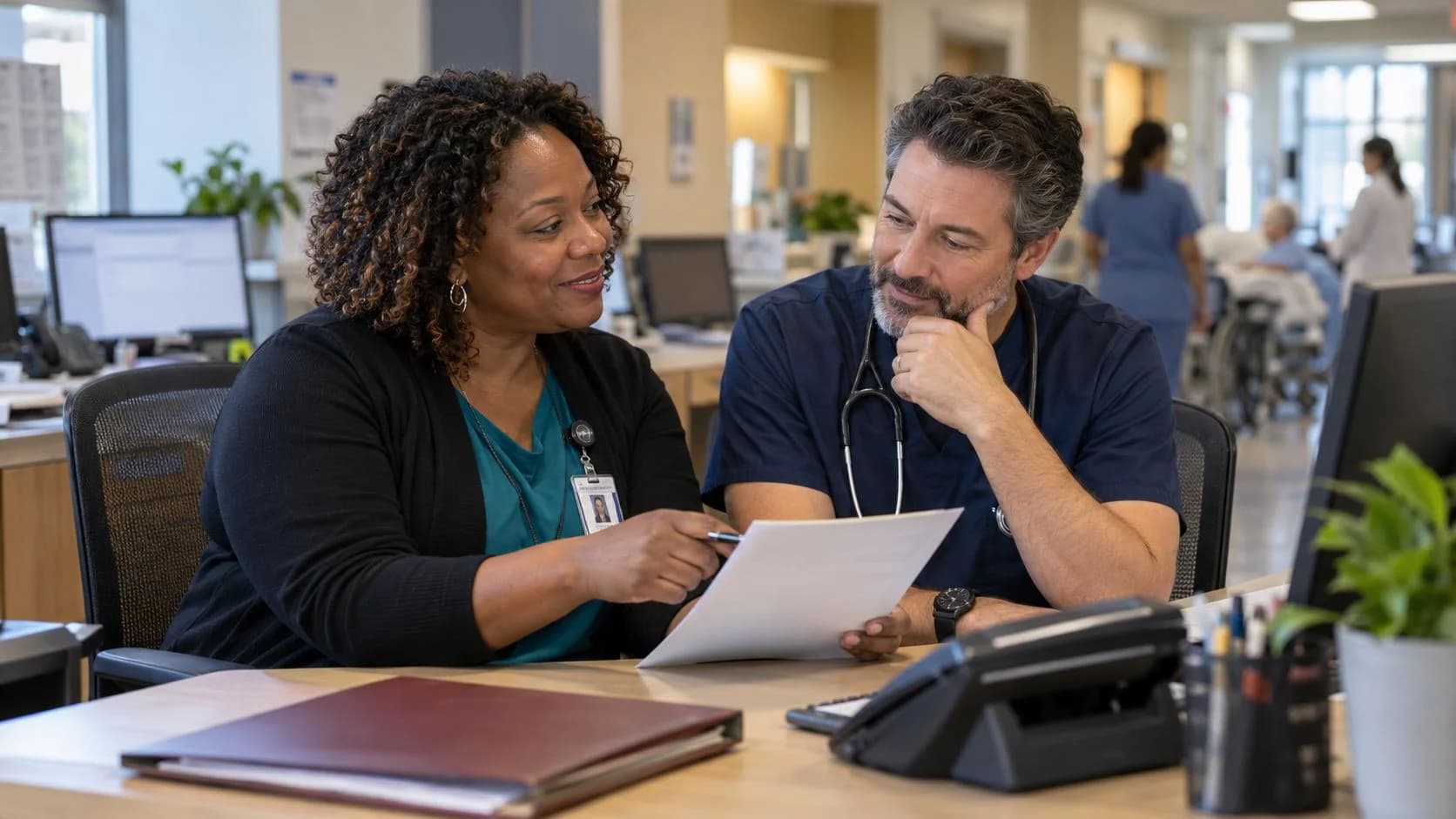 Medical coder and clinician resolving a claim detail together