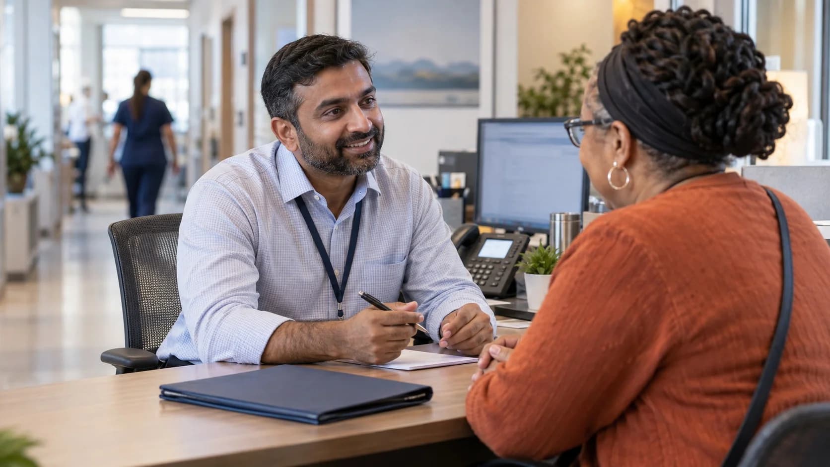 Patient financial counselor explaining a billing responsibility to a patient