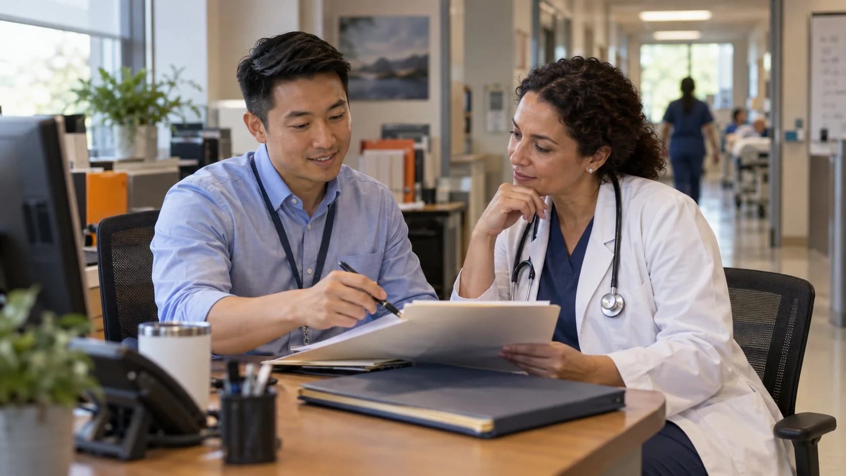 Medical coder and clinician resolving a claim detail together