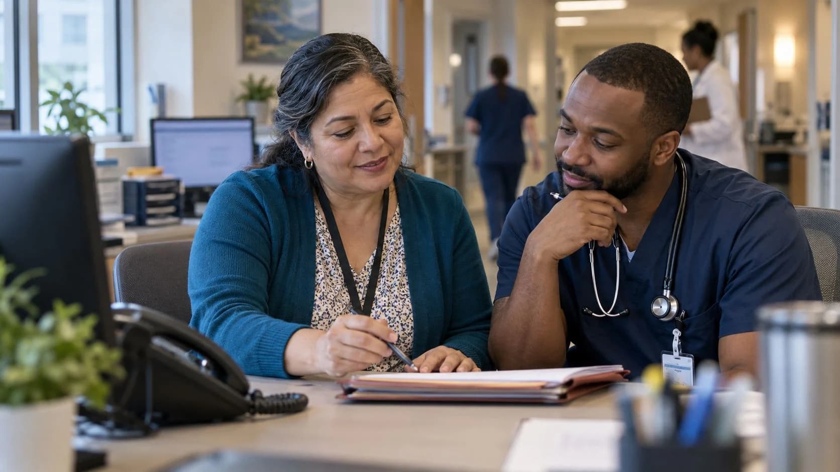 Medical coder and clinician resolving a claim detail together