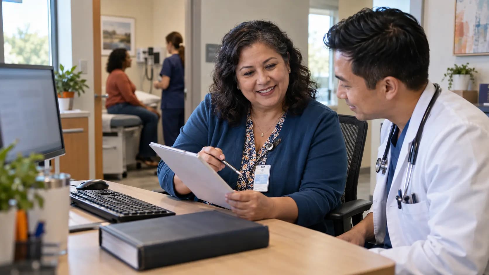 Medical coder and clinician resolving documentation together
