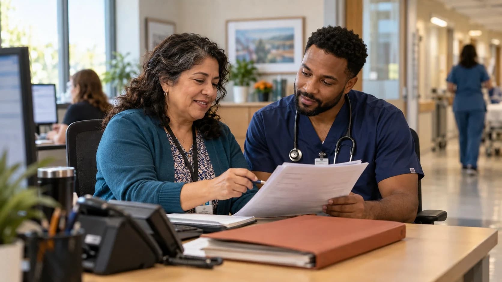 Medical coder and clinician resolving a claim detail together