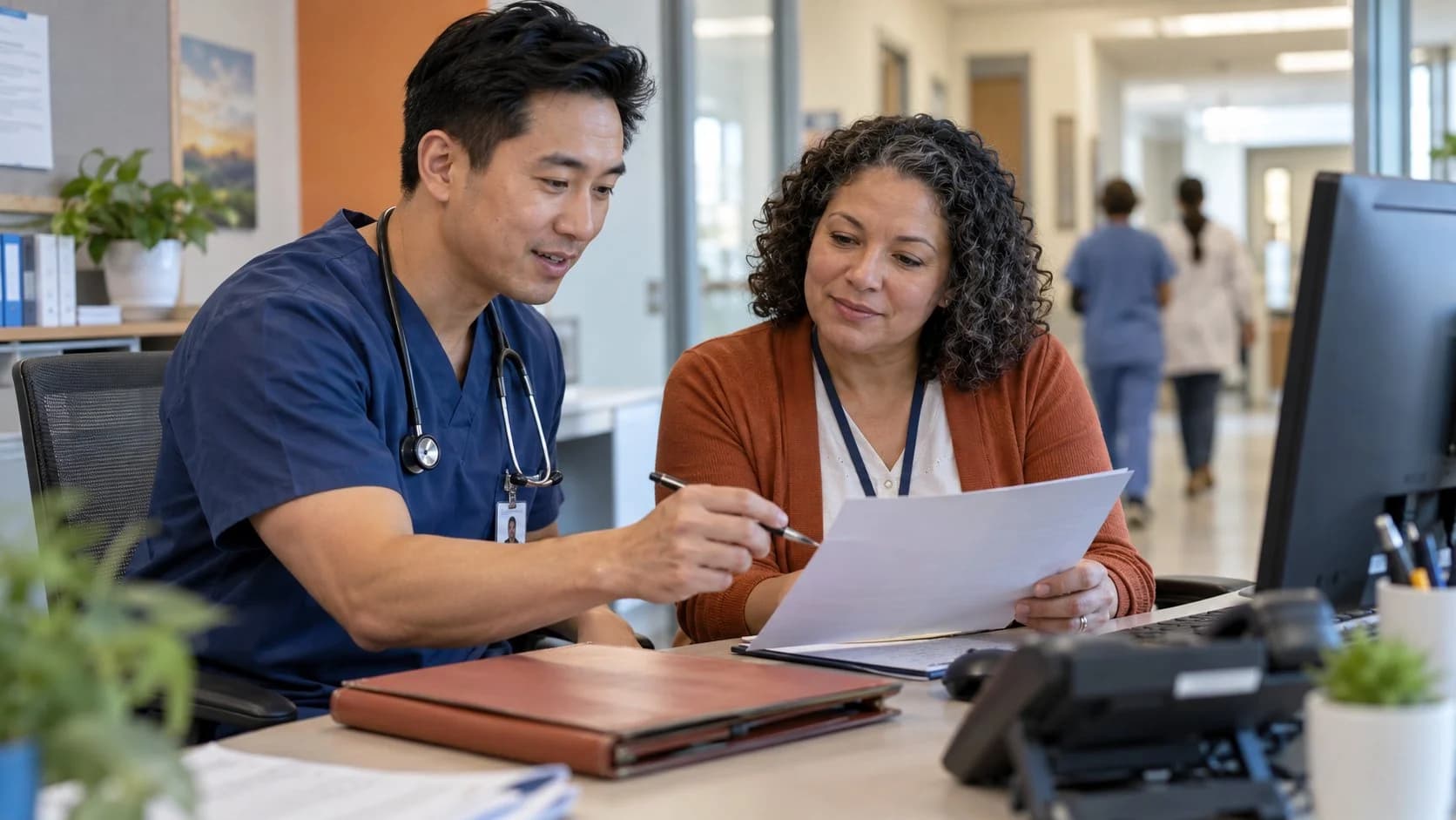 Medical coder and clinician resolving a claim detail together