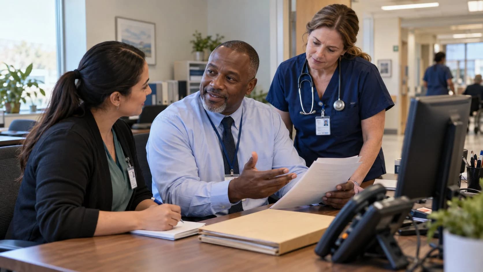 Patient-access coordinator and clinician resolving an authorization issue