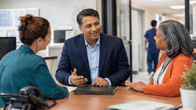 Reimbursement analyst and revenue manager reviewing a payment variance
