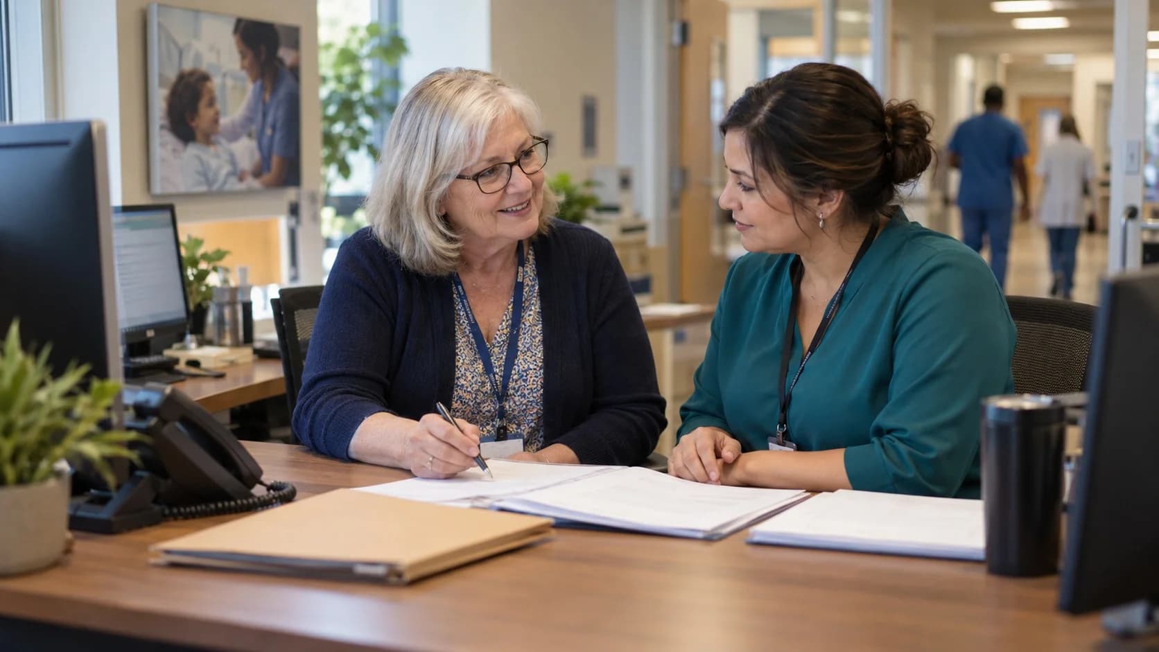 Reimbursement analyst and revenue manager reviewing a payment variance