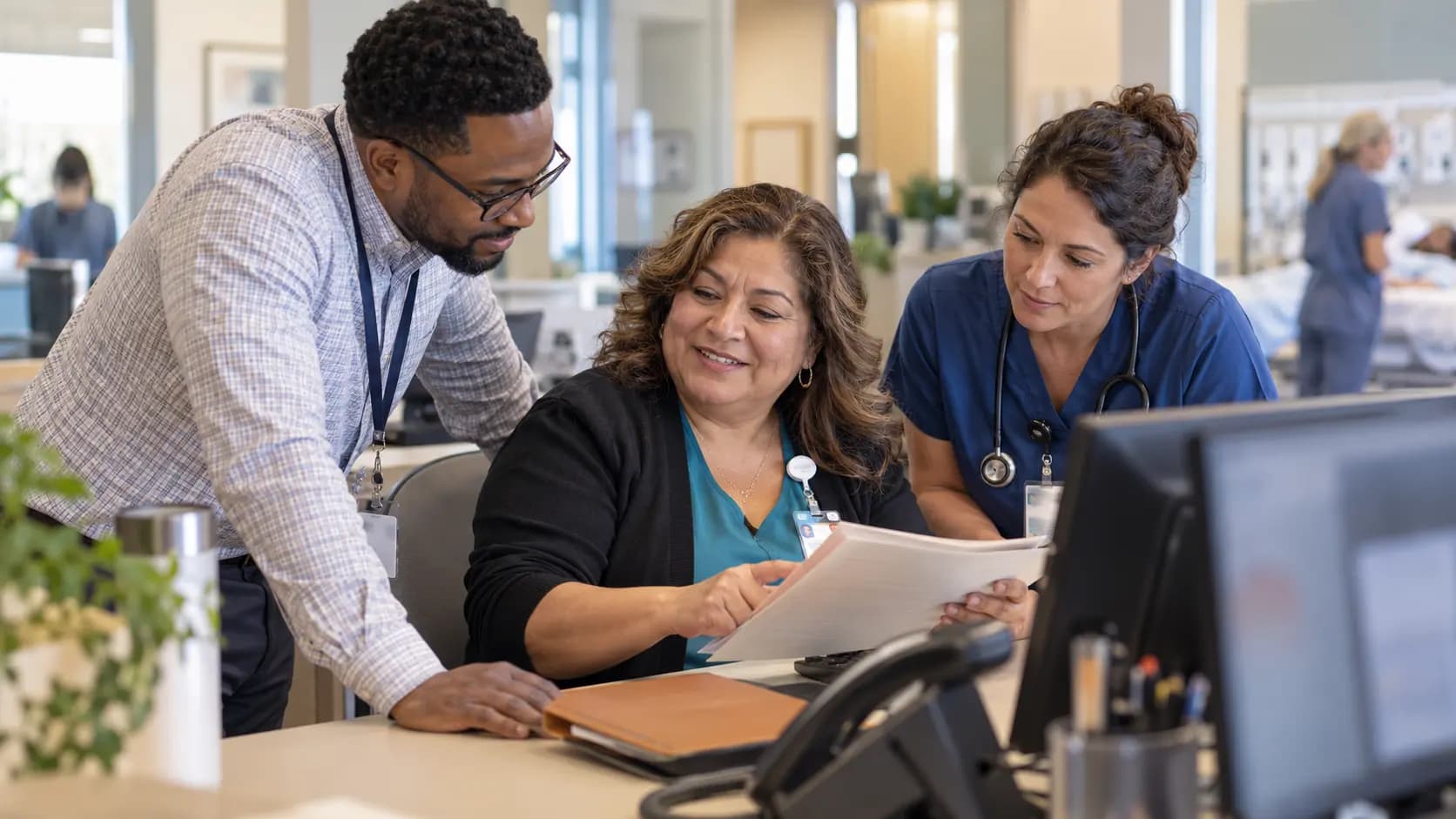 Revenue-cycle specialist and clinician resolving a billing workflow together Revenue-cycle specialist and clinician resolving a billing workflow together