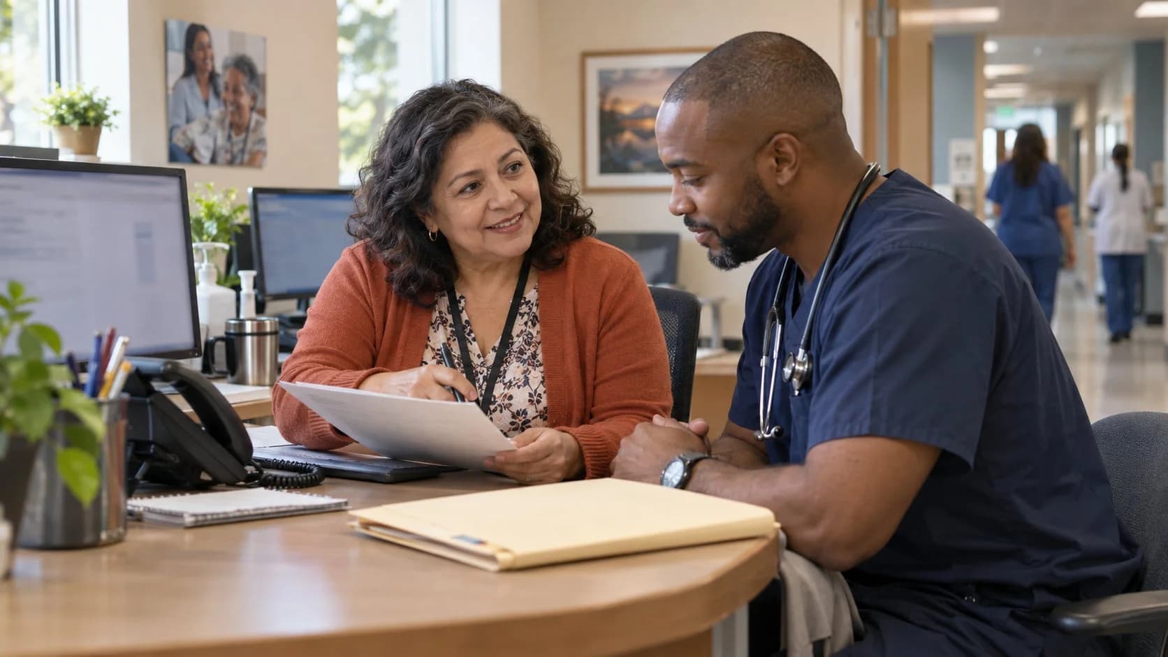 Medical coder and clinician resolving a claim detail together