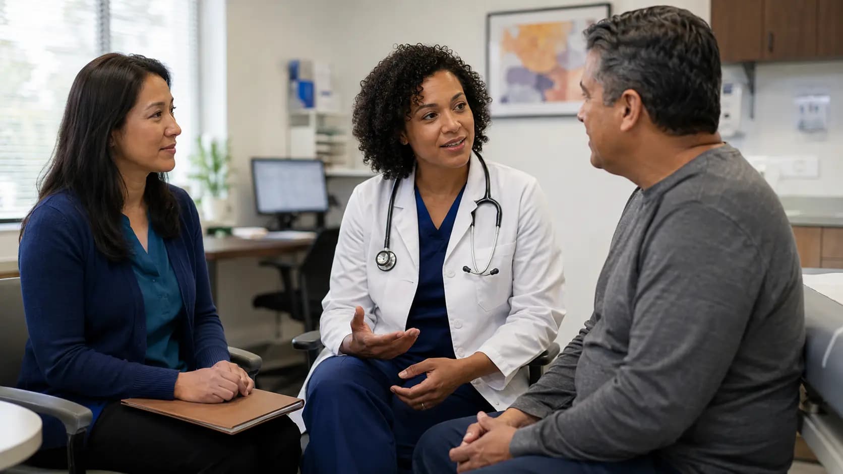 Clinician, patient, and healthcare colleague sharing a warm clinic interaction