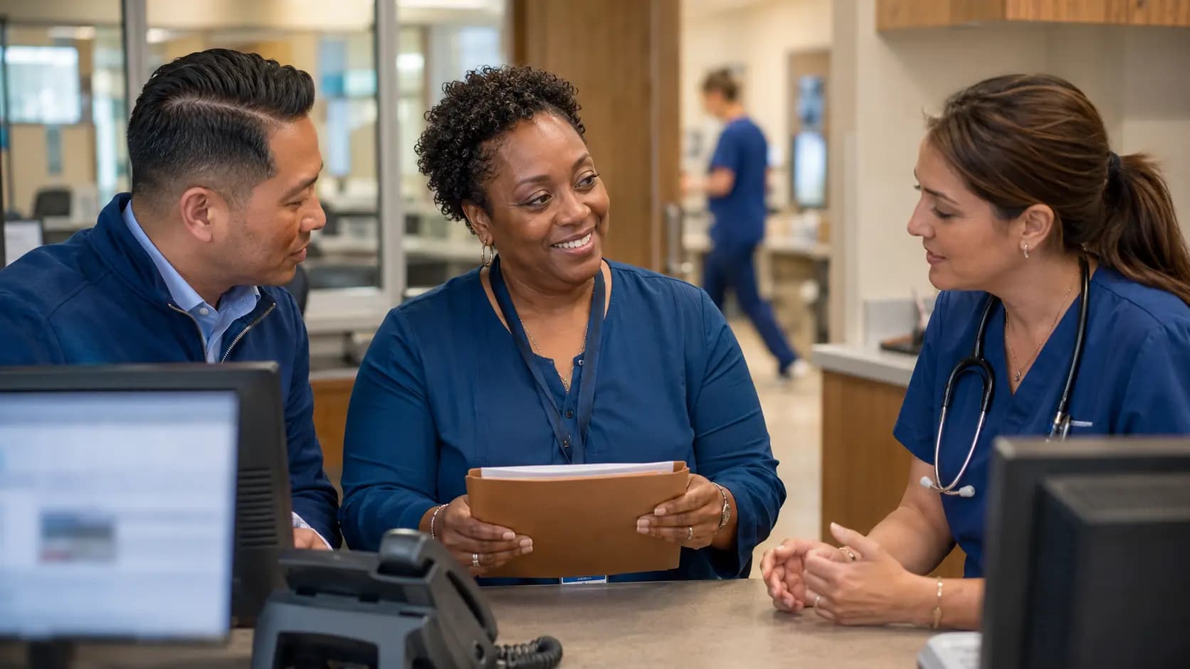 Revenue-cycle specialist and clinician resolving a billing workflow together