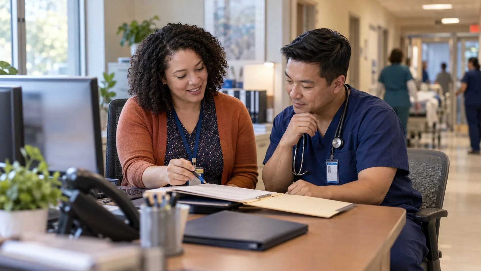 Medical coder and clinician resolving a claim detail together