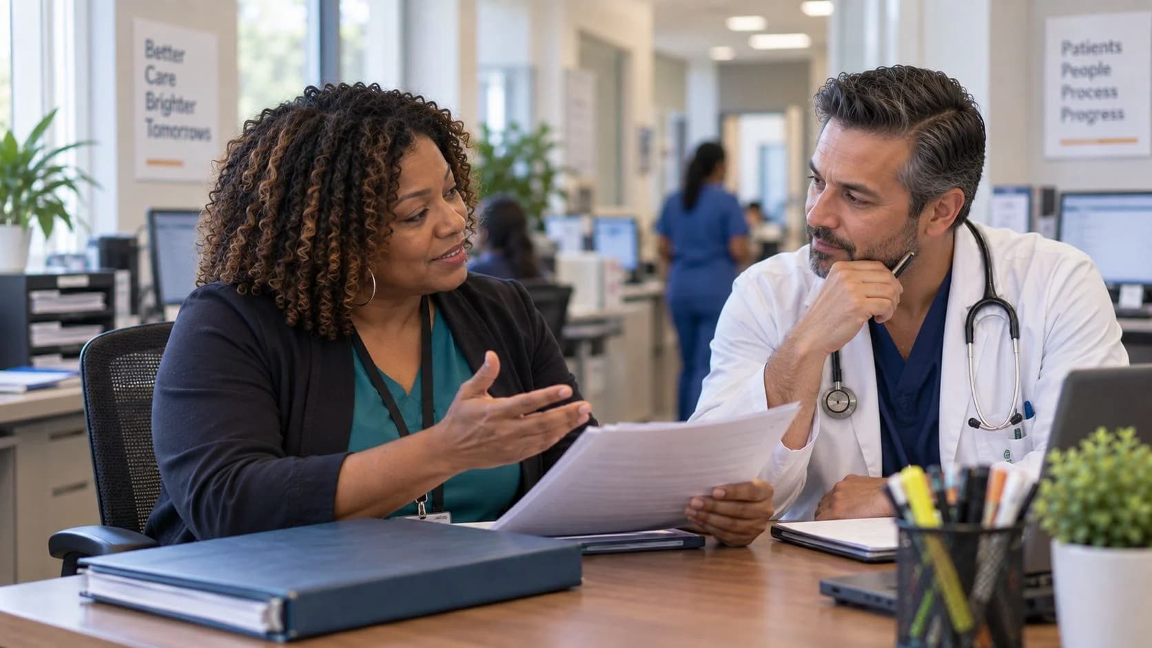Denial specialist and clinician reviewing a claim workflow together
