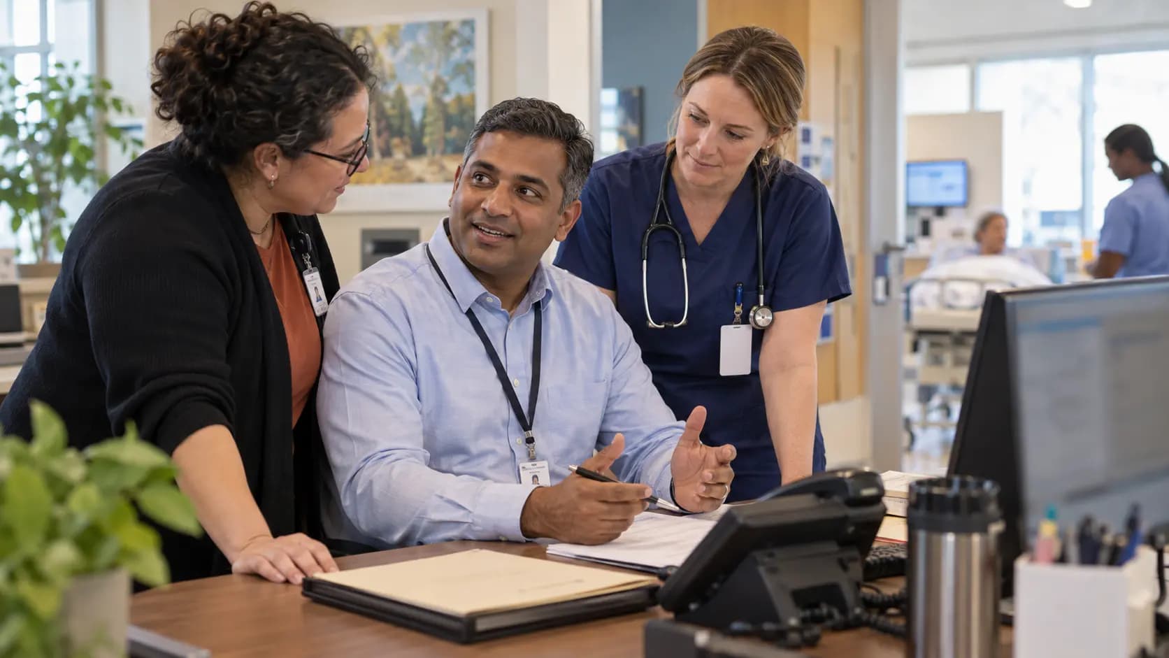 Revenue-cycle specialist and clinician resolving a billing workflow together Revenue-cycle specialist and clinician resolving a billing workflow together