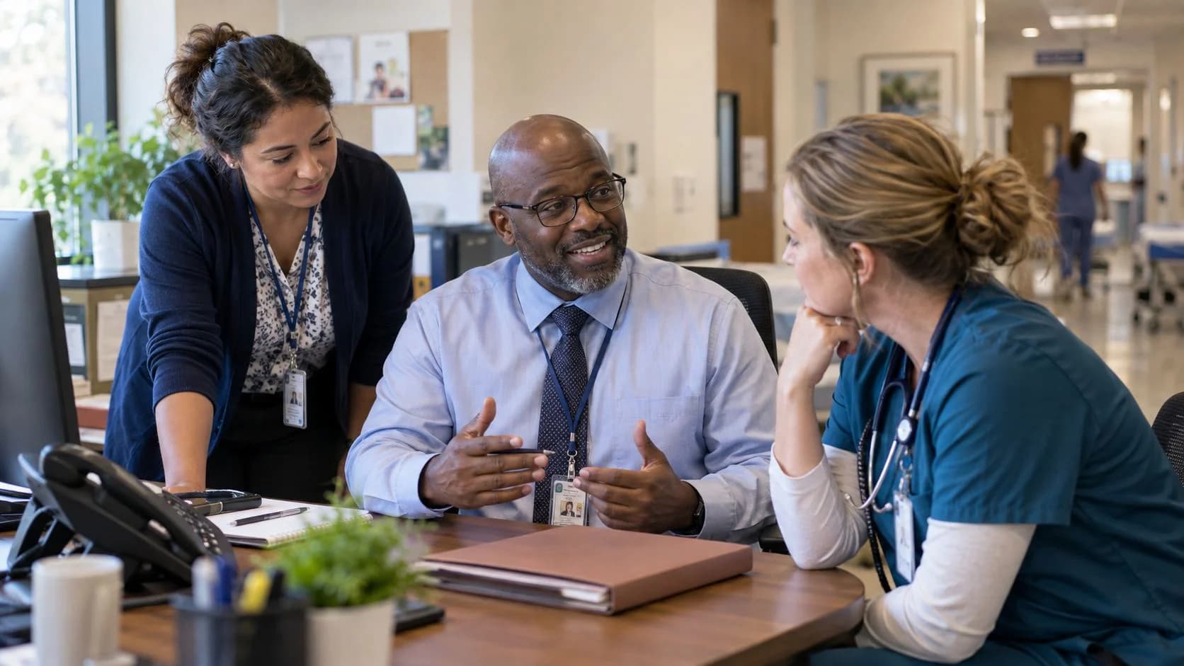 Patient-access coordinator and clinician resolving an authorization issue