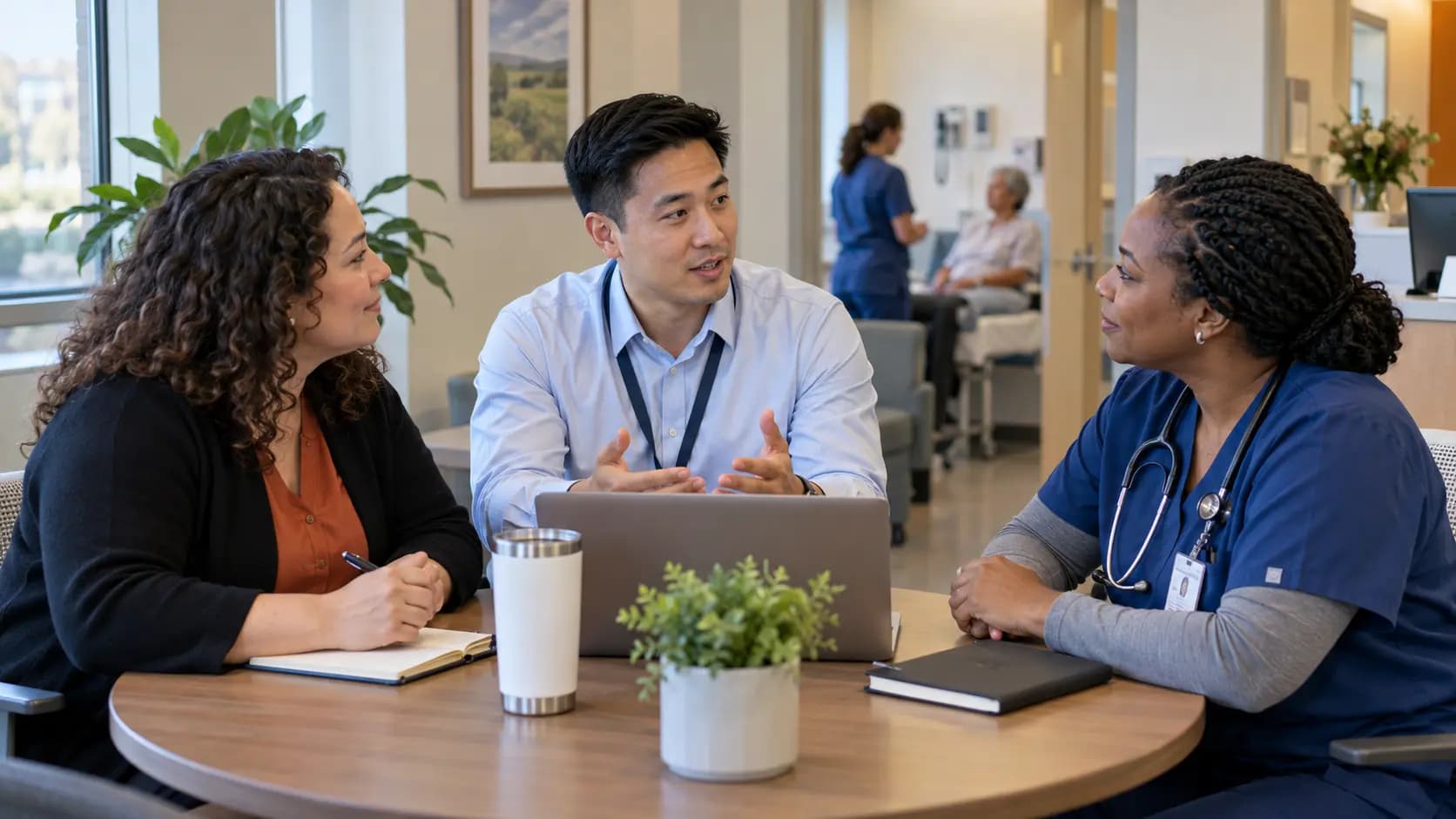 Healthcare operations and compliance colleagues collaborating in an office