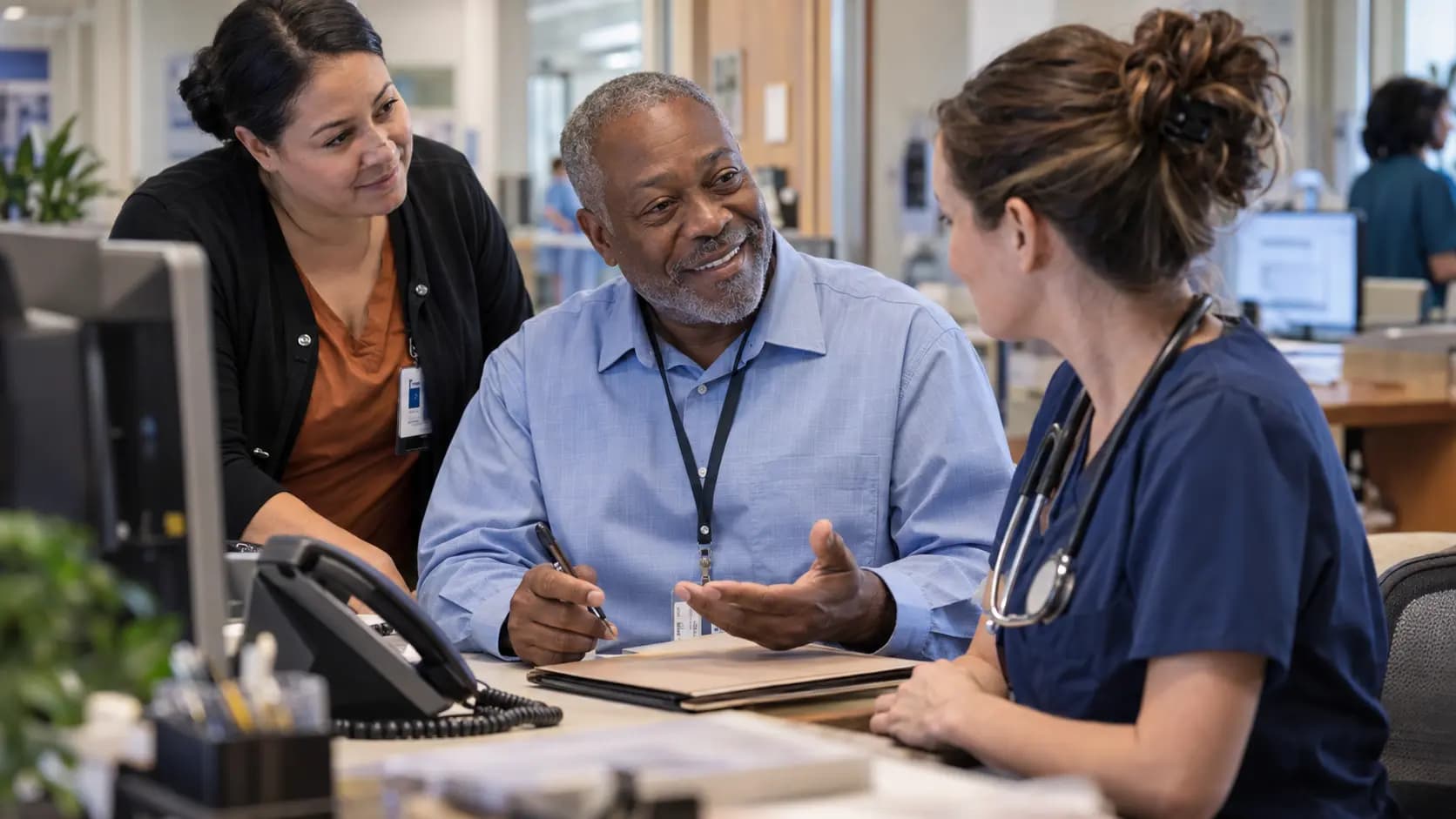 Revenue-cycle specialist and clinician resolving a billing workflow together
