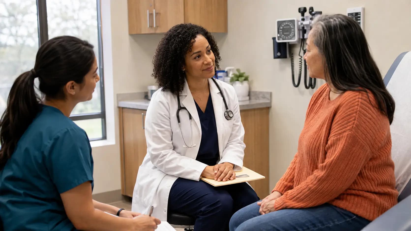 Specialty Care clinician and patient sharing a warm, attentive moment in a clinic