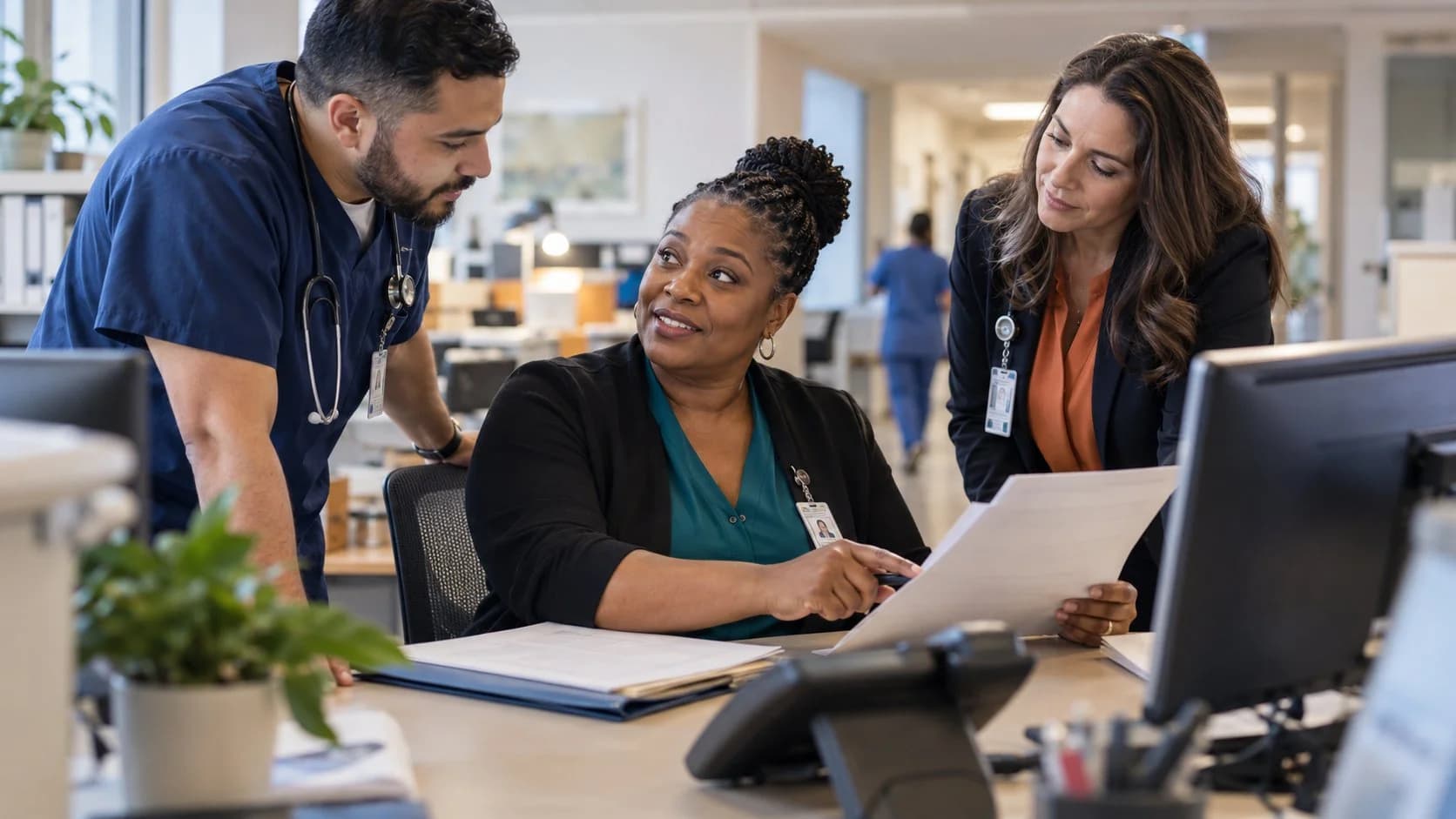 Denial-resolution specialist and clinician reviewing a claim together