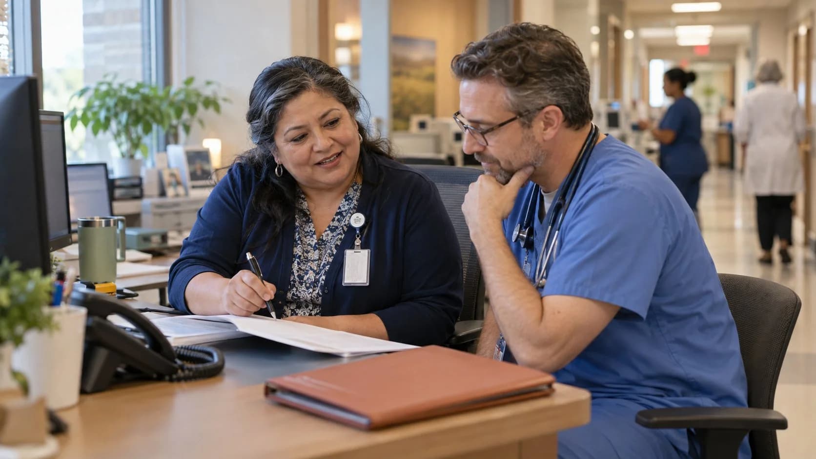 Medical coder and clinician resolving a claim detail together