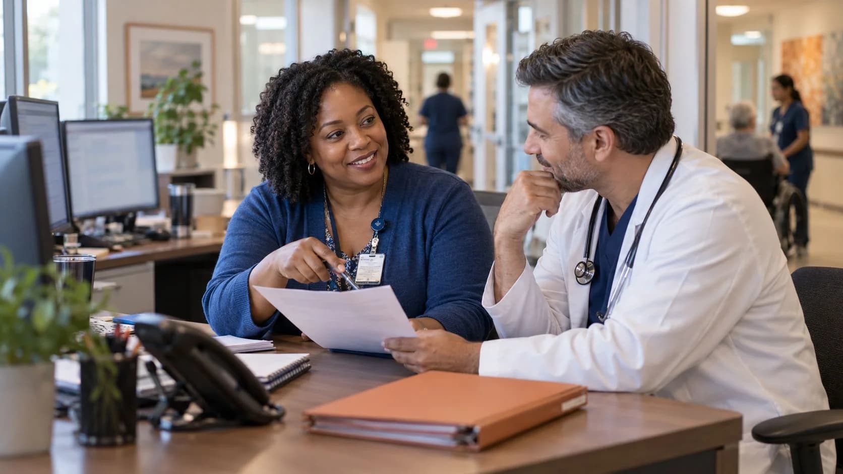 Medical coder and clinician resolving a claim detail together