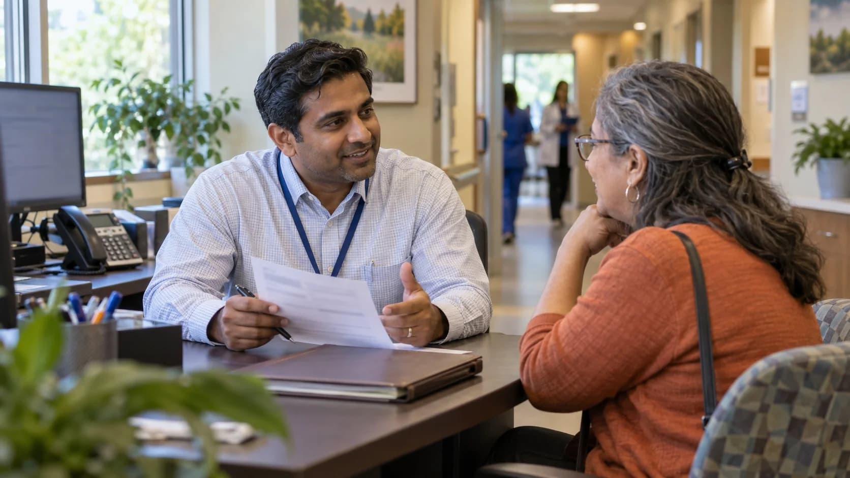 Patient financial counselor explaining a billing responsibility to a patient