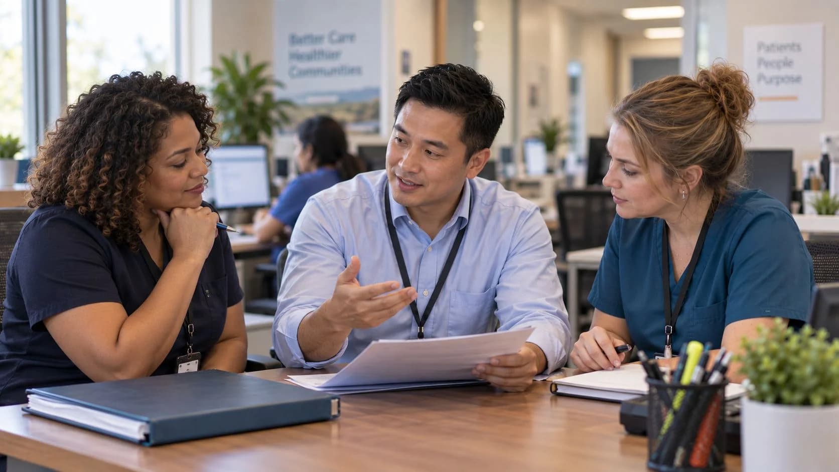 Revenue-cycle educator discussing a workflow with medical-office colleagues