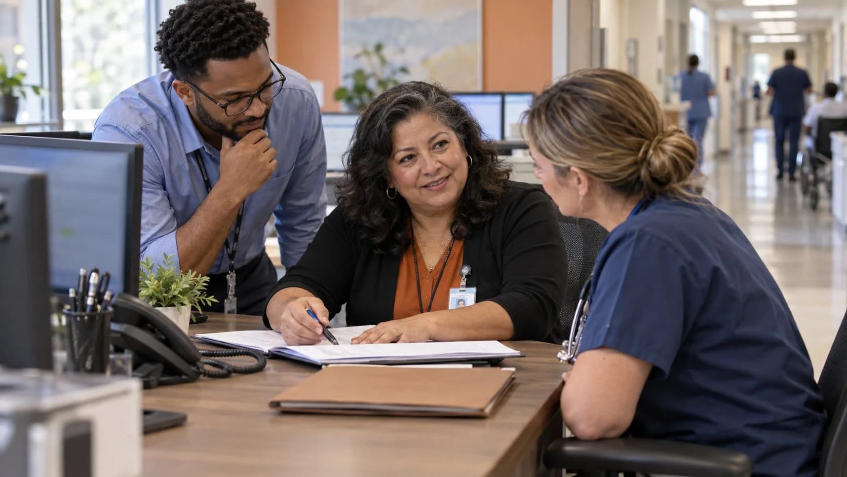 Denial-resolution specialist and clinician reviewing a claim together
