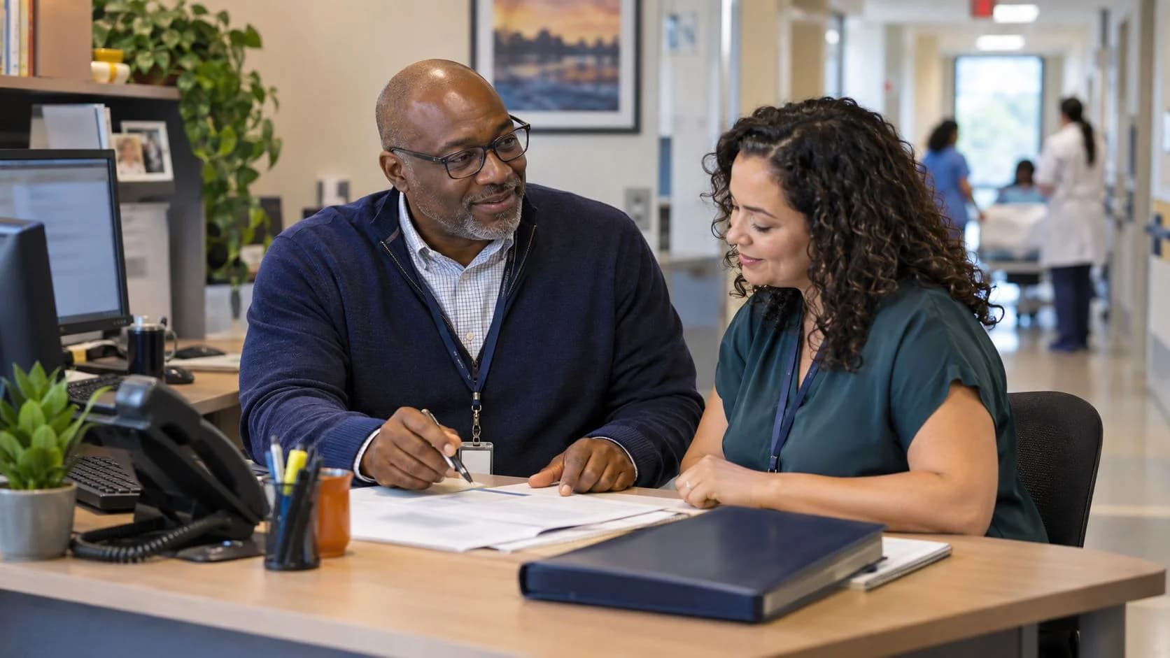 Reimbursement analyst and revenue manager reviewing a payment variance