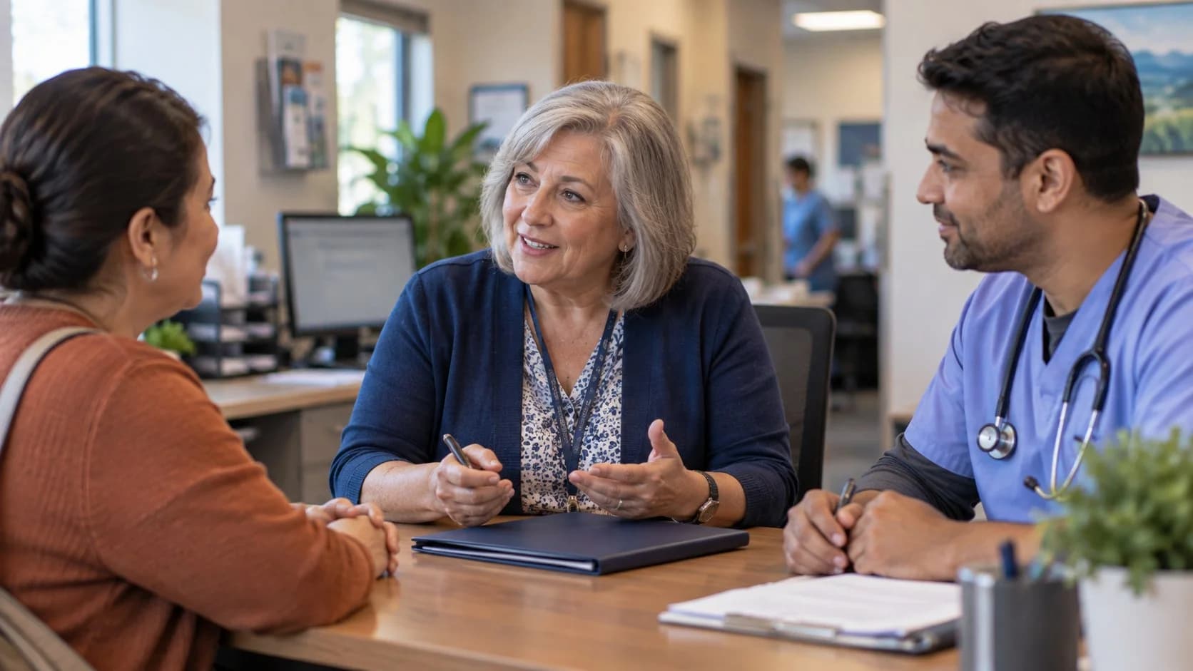Benefits coordinator helping a clinician and patient understand coverage