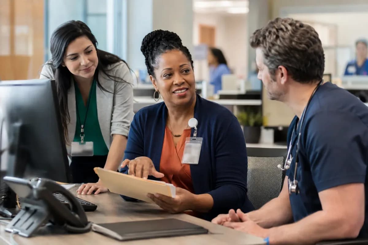 Revenue-cycle specialist and clinician resolving a billing workflow together